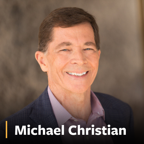 Michael Christian, man in suit smiling