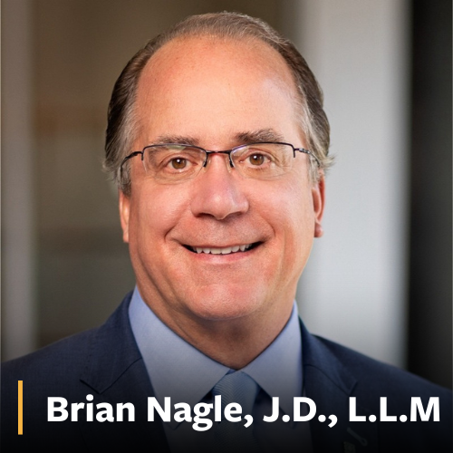 Brian Nagle, man in blue suit and tie smiling