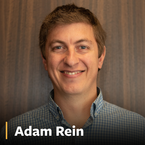 Adam Rein, man in checkered shirt smiling